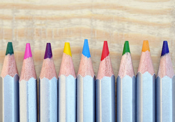 color pencils on wooden table background