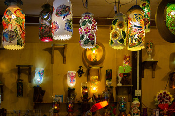 Colorful artificial lanterns from recycled plastic water bottles in Thai pedestrian street.