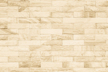 Cream and white brick wall texture background. Brickwork or stonework flooring interior rock old pattern clean concrete grid uneven bricks design stack.