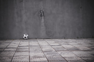 classic soccer ball near the gray wall © foras05