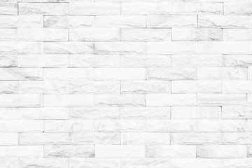 Cream and white brick wall texture background. Brickwork or stonework flooring interior rock old...
