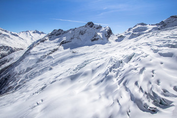 Fototapeta na wymiar Snow-covered glacier in a Mountains of Saas-Fee in Switzerland