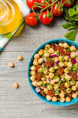 Chickpeas salad with onion and dried tomatoes.