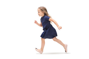 Smiling cute toddler girl three years running over white background