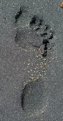 Foot print in black sand