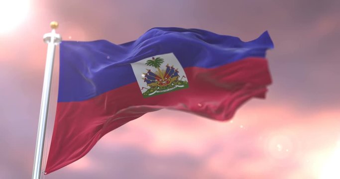 Flag of Haiti waving at wind at sunset, loop