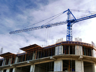 Fototapeta na wymiar Crane near building. Construction site background