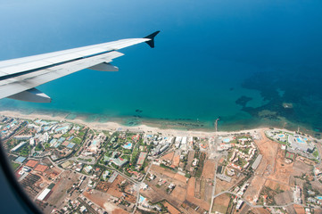 plane wing over beach
