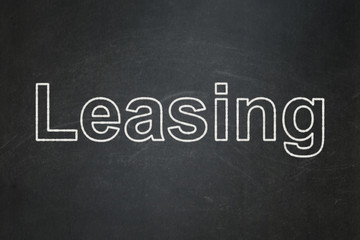 Finance concept: text Leasing on Black chalkboard background