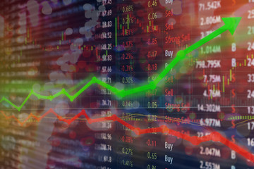 Investing and stock market concept gain and profits with faded candlestick charts.
