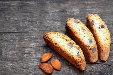 Traditional italian cantuccini almond cookies on old wooden background.Delicious homemade cantucci biscotti.Selective focus.