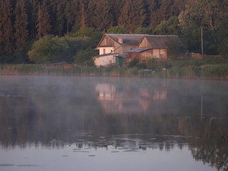 Fototapeta na wymiar Summer misty morning in the village