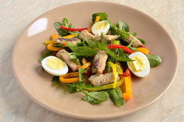 Fish salad with quail eggs, sweet peppers and fresh herbs