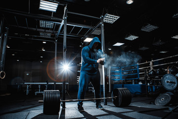 Strong man working in gym