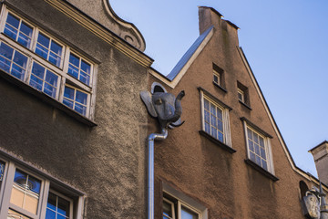 The facade of the beautiful historic building on the street of the Old Town of Gdansk. Poland