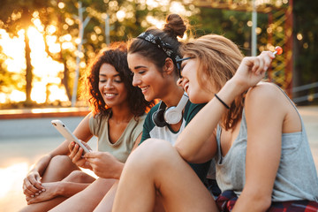 Three excited young girls having fun