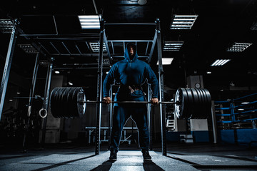 Strong man working in gym