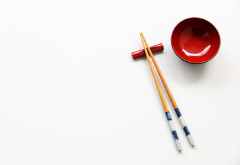 wood Chopsticks and Red bowl for sushi on White background