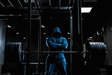 Strong man working in gym
