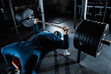 Strong man working in gym