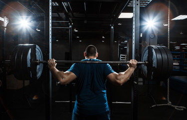 Strong man working in gym