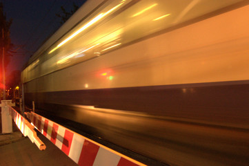 Fototapeta na wymiar Train blurred image, night crossing junction quick 