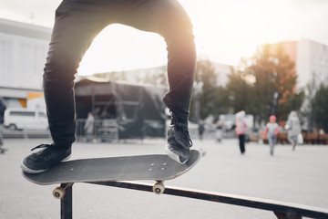 Male skateboarder performs tricks on ramp on skateboard. Concept street sports, bully