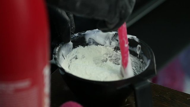 process of mixing of components for reception without an aldehyde paint in a beauty salon. slow motion