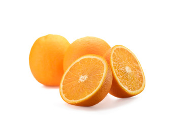 close up view of wholesome and cut oranges isolated on white