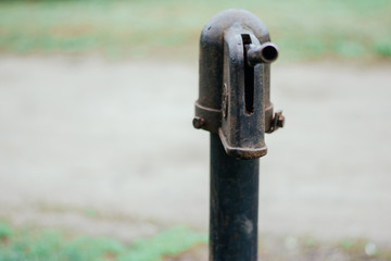 Iron column for water. Rusted iron. Column background in natural environment