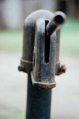Iron column for water. Rusted iron. Column background in natural environment