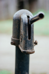 Iron column for water. Rusted iron. Column background in natural environment