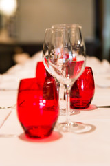 Restaurant Table Red Glass Decoration with Blurred Background.