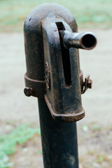 Iron column for water. Rusted iron. Column background in natural environment