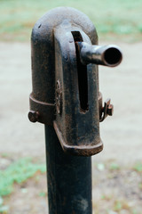 Iron column for water. Rusted iron. Column background in natural environment