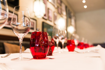 Restaurant Table Red Glass Decoration with Blurred Background.