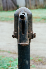 Iron column for water. Rusted iron. Column background in natural environment