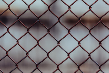 Metal mesh. Rusty mesh. The texture of the rusty mesh. Natural mesh in the village.