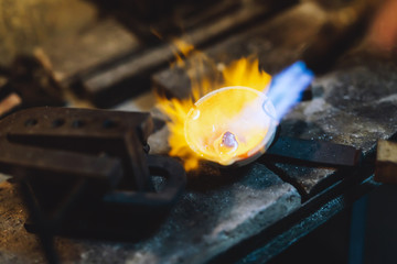 Jeweler melting gold