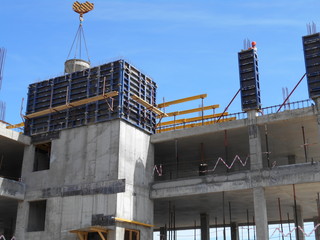 Workers at the construction site, building high-rise buildings.