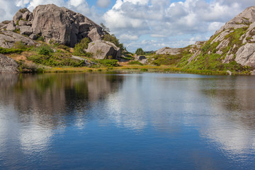 Fototapeta na wymiar Mountain lake with water lilies in Egersund, Jaeren national scenic route in western Norway