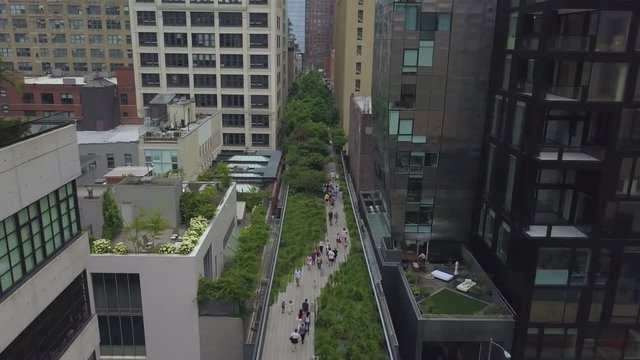 low aerial shot flying south over Manhattan's High Line Park