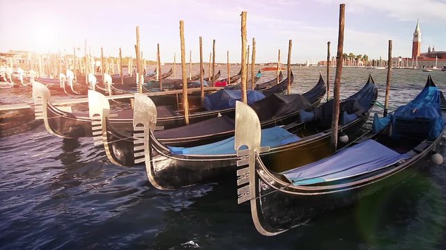 Famous Venice gondolas in Grand Canal. Looping movie. Cinemagraph