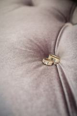 Wedding rings on grey background