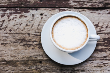 Cappuccino cup on wooden table