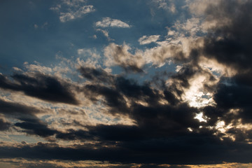 Naklejka na ściany i meble Dramatic cloudy sky on the sunset