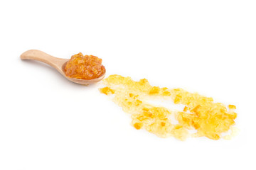 Strawberry, orange and blueberries jam with wooden spoon on a white background.