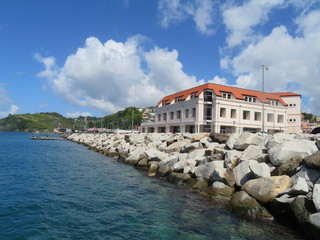 Buildings along the coastline of St. George harbor in the Caribbean island of Grenada