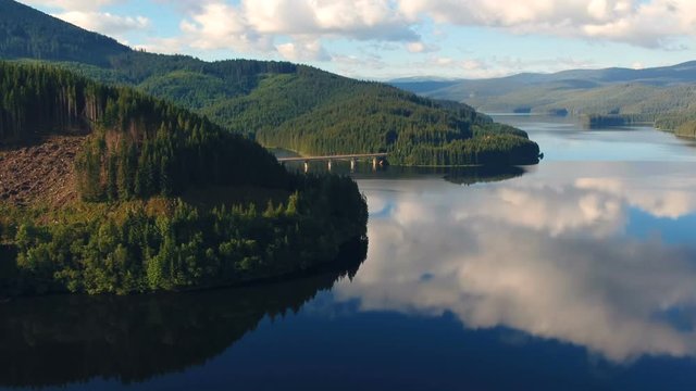 Aerial view of a road crossing Oasa lake, near Transalpina and Sibiu, Romania