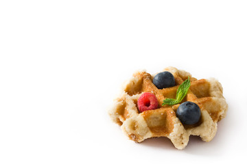 Traditional belgian waffles with blueberries and raspberries isolated on white background. Copyspace